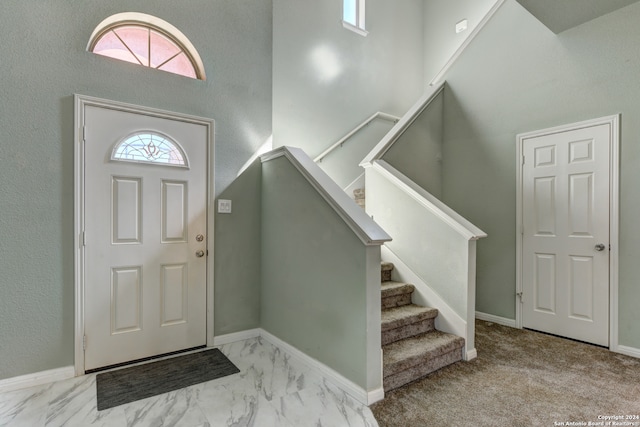 view of carpeted foyer