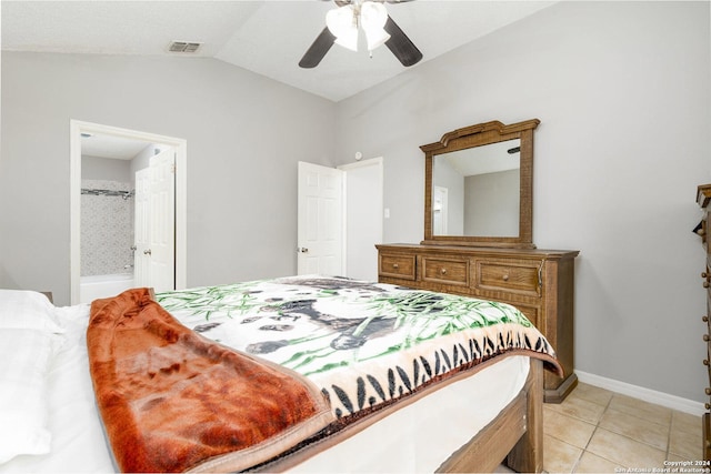 bedroom with lofted ceiling, light tile patterned floors, ensuite bath, and ceiling fan