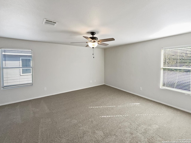 carpeted empty room with ceiling fan