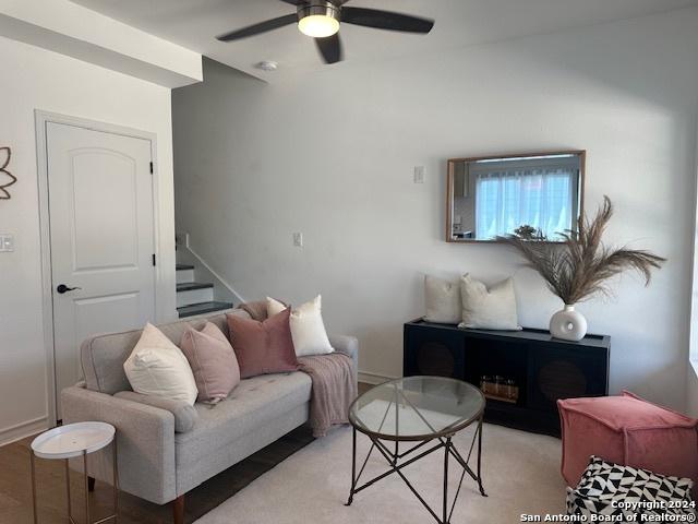 living room with ceiling fan