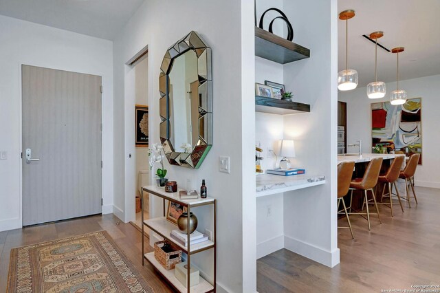 hallway with wood-type flooring