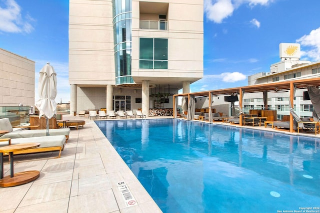 view of swimming pool with a patio