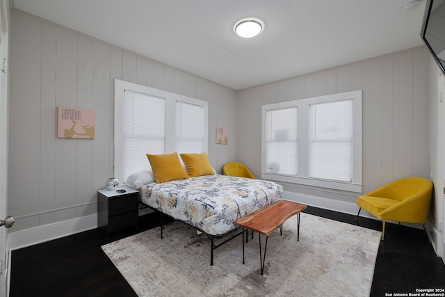 bedroom with hardwood / wood-style flooring