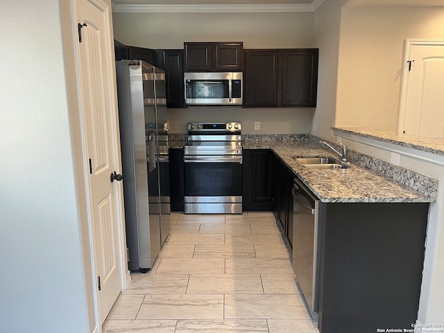 kitchen featuring crown molding, sink, light stone countertops, appliances with stainless steel finishes, and light tile patterned floors