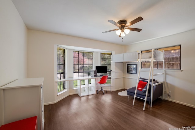 sitting room with ceiling fan and dark hardwood / wood-style floors