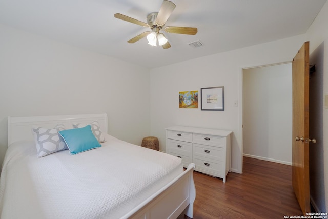 bedroom with dark wood-type flooring and ceiling fan