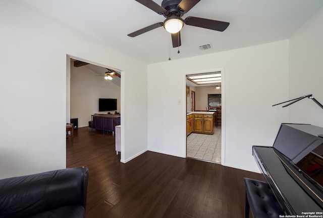 living room with ceiling fan and hardwood / wood-style floors