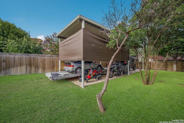 view of car parking featuring a carport and a lawn