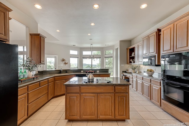 kitchen featuring black appliances, light tile patterned floors, a center island, kitchen peninsula, and sink