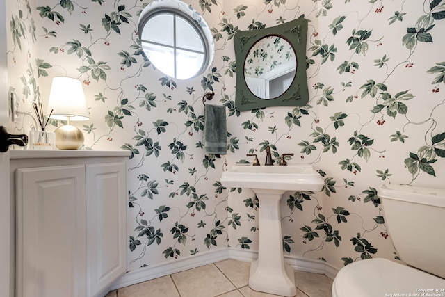 bathroom featuring toilet and tile patterned floors