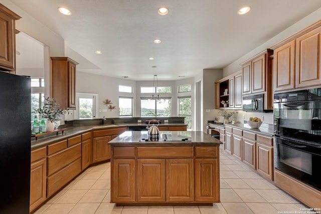 24434 Blanco Rd, San Antonio, TX 78260 - kitchen with a sink, black appliances, a peninsula, and light tile patterned floors