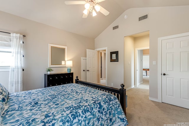 carpeted bedroom featuring vaulted ceiling and ceiling fan