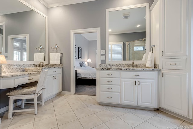 24434 Blanco Rd, San Antonio, TX 78260 - bathroom with tile patterned floors, a stall shower, two vanities, and ornamental molding
