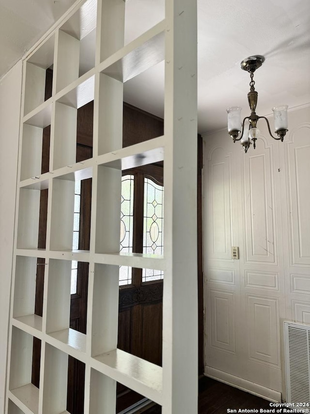 details with a notable chandelier and french doors