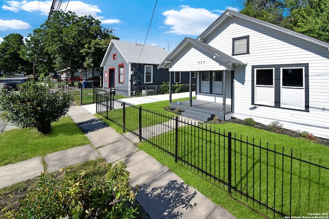 bungalow-style home featuring a front yard