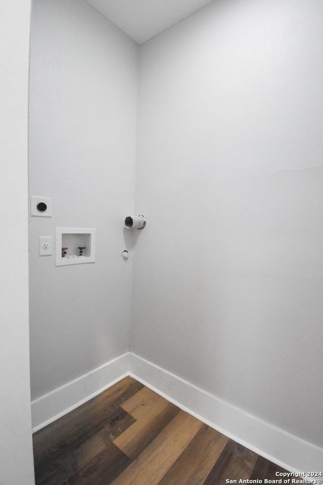 laundry area with hookup for a washing machine, hardwood / wood-style flooring, and hookup for an electric dryer