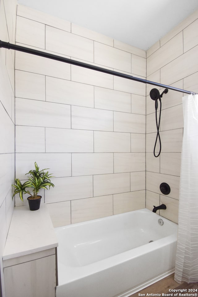 bathroom featuring shower / bath combo with shower curtain