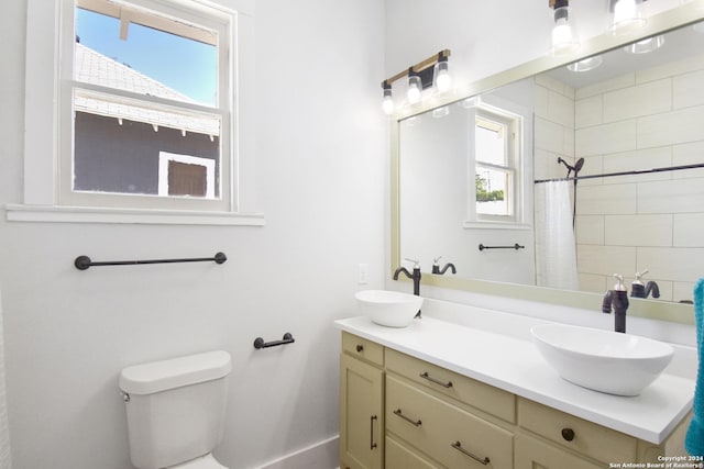 bathroom with vanity, toilet, and a shower with curtain