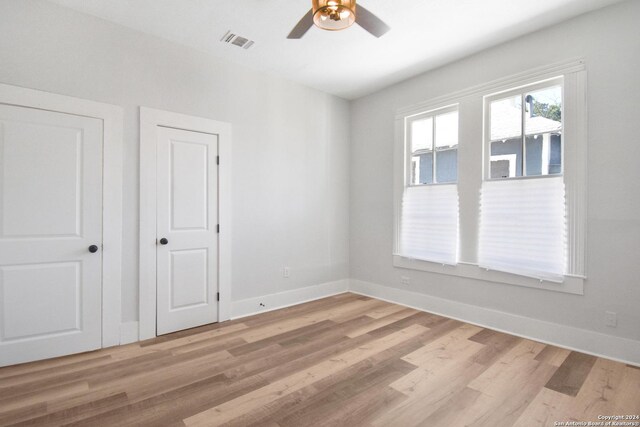 interior space featuring light hardwood / wood-style floors and ceiling fan