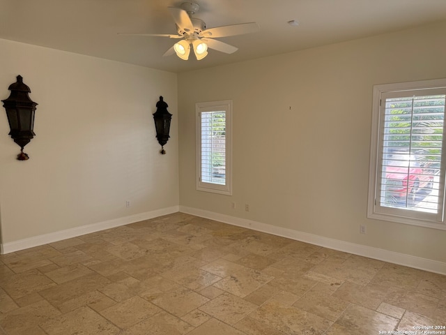 unfurnished room with ceiling fan