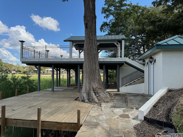 rear view of house with a patio and a deck