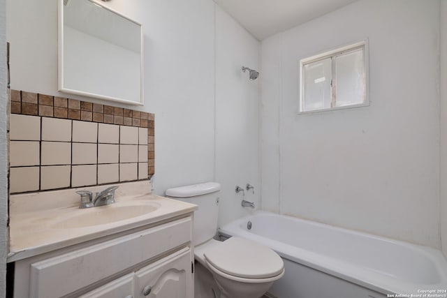 full bathroom featuring tasteful backsplash, vanity, washtub / shower combination, and toilet