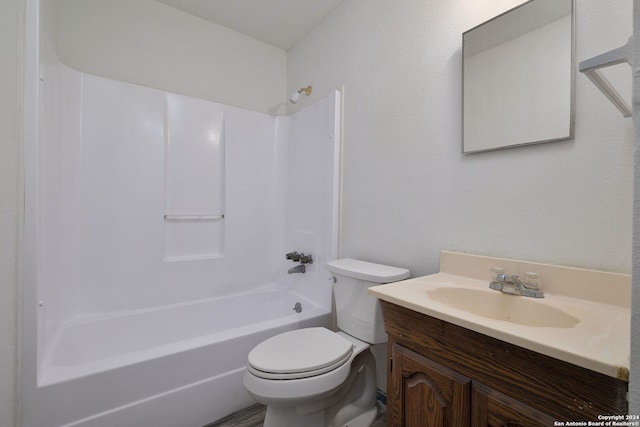 full bathroom with vanity, washtub / shower combination, and toilet