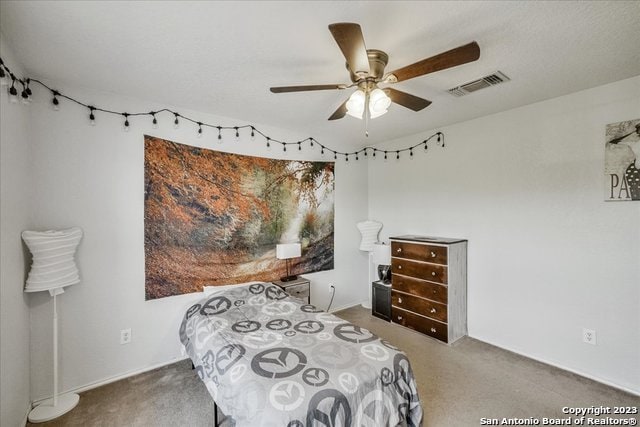 carpeted bedroom featuring ceiling fan