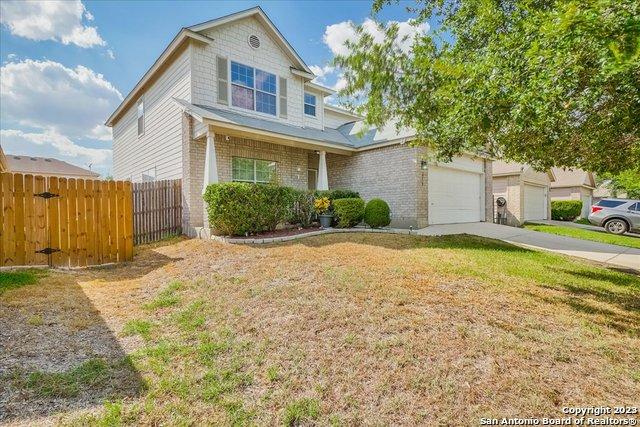 view of front property with a garage and a front lawn