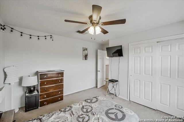 bedroom featuring a closet, carpet, and ceiling fan