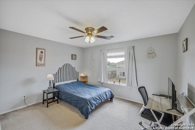 bedroom with light carpet and ceiling fan