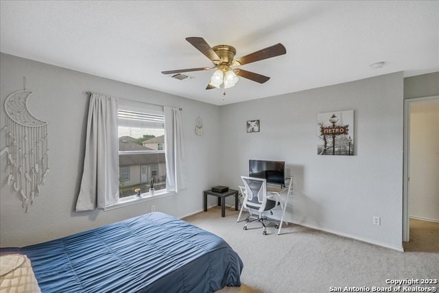 bedroom featuring light carpet and ceiling fan