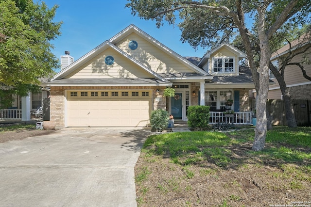 view of front of home with a garage and covered porch