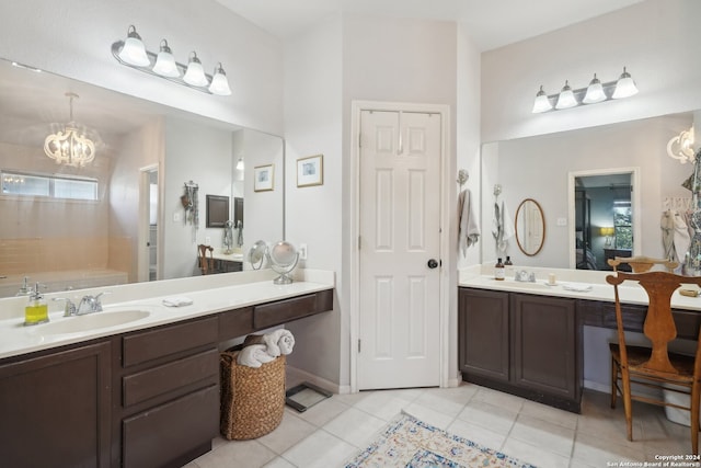 ensuite bathroom with tile patterned flooring, a notable chandelier, vanity, and ensuite bathroom