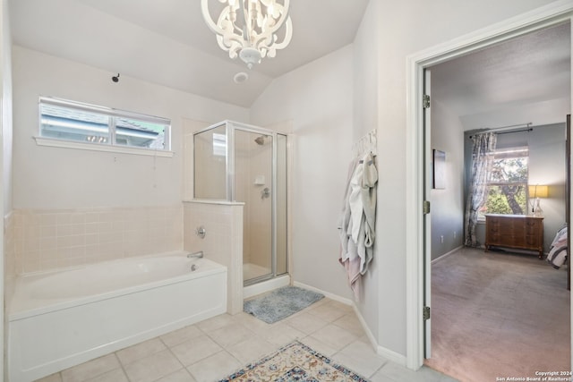 ensuite bathroom with ensuite bathroom, lofted ceiling, tile patterned floors, a stall shower, and an inviting chandelier