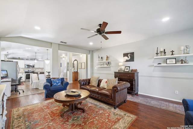 living room with a ceiling fan, wood finished floors, visible vents, and recessed lighting