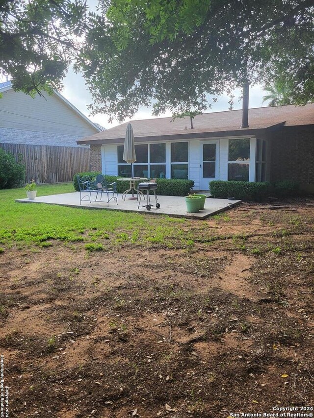 rear view of house featuring a patio