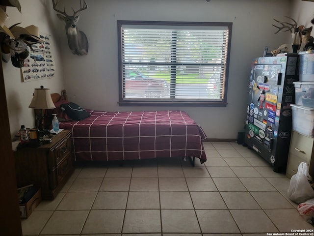 bedroom featuring light tile patterned flooring