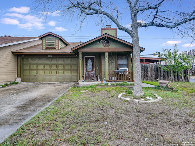 ranch-style home with a garage and covered porch