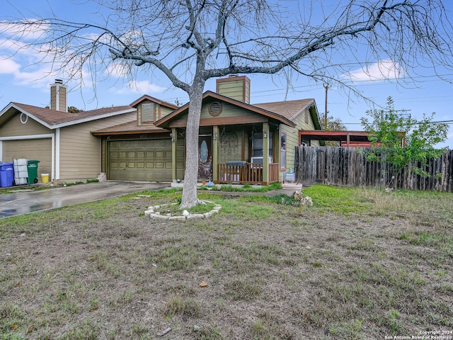 single story home with a garage, a porch, and a front lawn