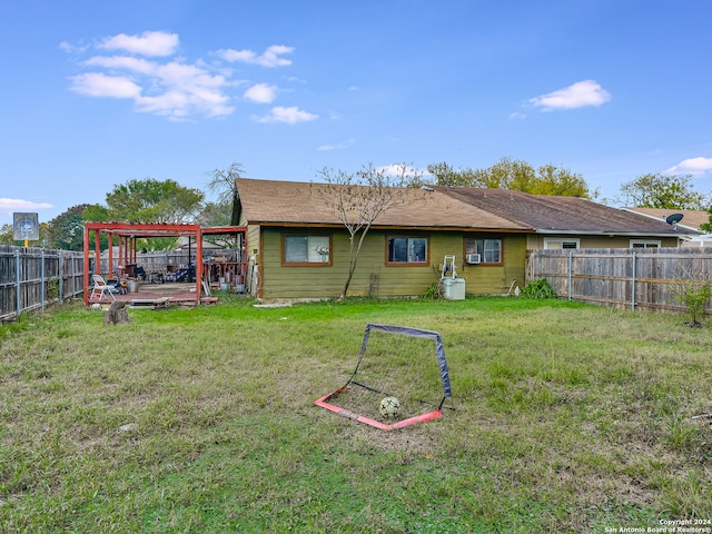 back of property featuring a lawn