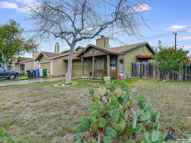 view of front of home featuring a garage and a front lawn