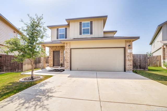 view of front facade featuring a front lawn and a garage