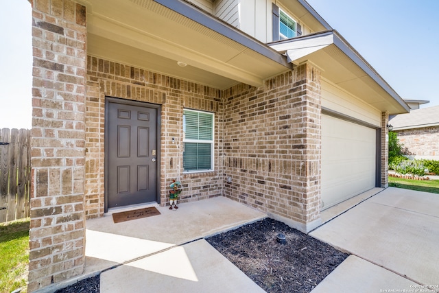 view of exterior entry featuring a garage