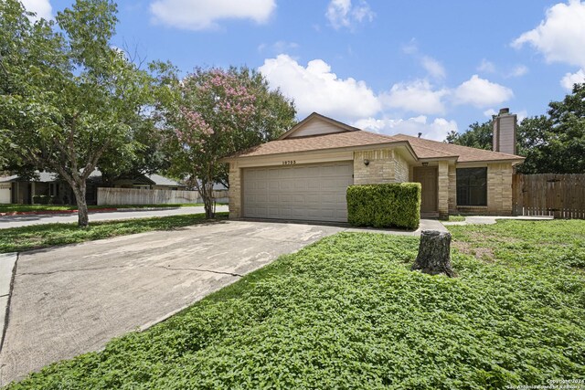 ranch-style home with a garage