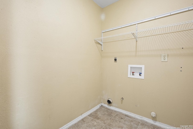 laundry area featuring gas dryer hookup, washer hookup, light tile patterned floors, and hookup for an electric dryer