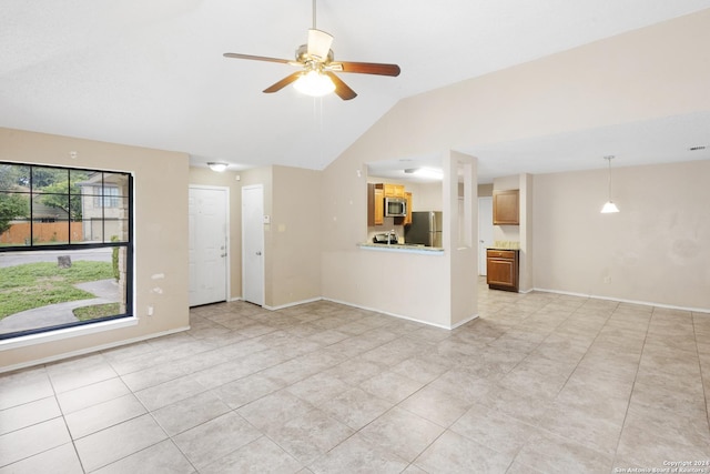 unfurnished living room with light tile patterned flooring, lofted ceiling, and ceiling fan