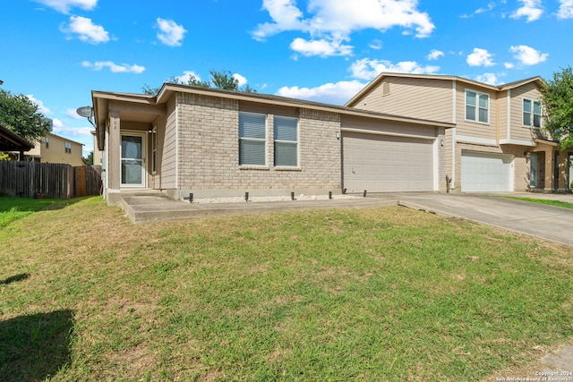 view of front of house with a garage and a front lawn