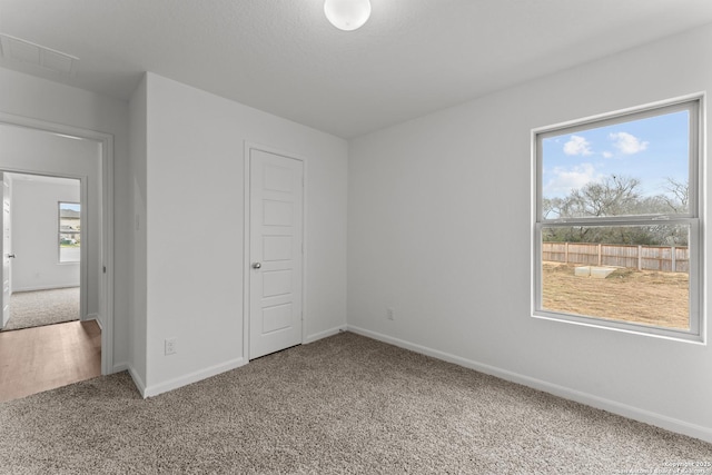 unfurnished bedroom featuring a closet and carpet flooring