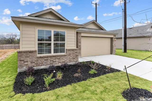 ranch-style house featuring a front yard and a garage